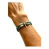 Pulsera con dije de libélula ajustable sobre cinta bordada oaxaqueña
